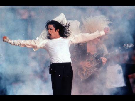  In this February 1, 1993, file photo, Michael Jackson performs during the halftime show at the Super Bowl in Pasadena, California. Apple Music announced on Wednesday, their 10 greatest albums of all time and Jackson’s 1982 ‘Thriller’ came in second 