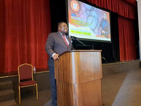 Motivational speaker Jermaine Johnson, the I Believe Initiative Ambassador for the Governor General’s Programme for Excellence, addressing the Annual Business Conference of the Montego Bay Community College’s Faculty of Business and General Studies at 