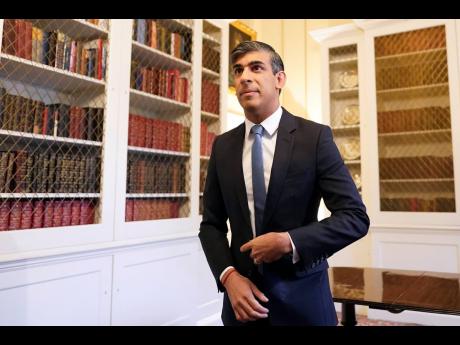 
Britain’s Prime Minister Rishi Sunak in Downing Street,London, on Wednesday May 22, 2024, after speaking about the latest inflation figures.