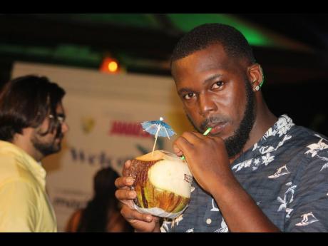 Above: Decordeva Rhoden holds his coconut close to his chest, it being a highly sought-after item on the night.