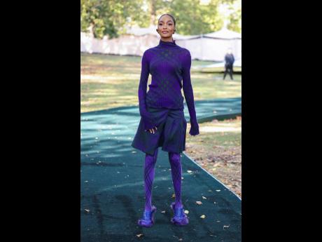 Jourdan Dunn, clad in purple, poses for photographers at Burberry’s Spring Summer 2024 fashion show in London on September 18, 2023.