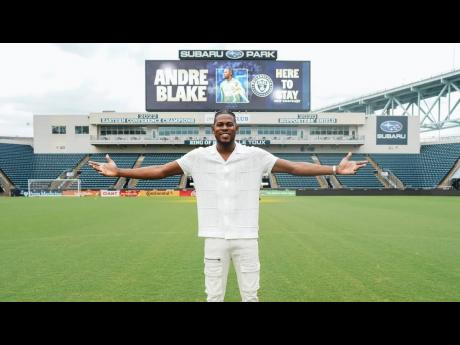 Reggae Boy captain and Philadelphia Union goalkeeper Andre Blake poses in front of a prompter announcing his contract extension with the latter at the Subaru Park.
