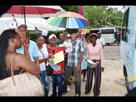 Residents of Pisgah in St Elizabeth waiting to benefit from free health services during the event on Tuesday.