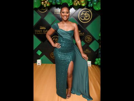 Keeping the accessories simple, Jada Silvera stunned in this emerald green gown from Style Savvy Boutique. 