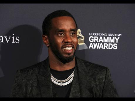 Sean Combs arrives at the Pre-Grammy Gala And Salute To Industry Icons at the Beverly Hilton Hotel in California in 2020.  A woman who says Combs subjected her to violence and abuse over several years in the 1990s filed a lawsuit in New York, Thursday, May