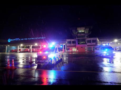 Ambulances are seen at the airport where a London-Singapore flight that encountered severe turbulence was diverted to, in Bangkok, Thailand, Tuesday, May 21, 2024.
