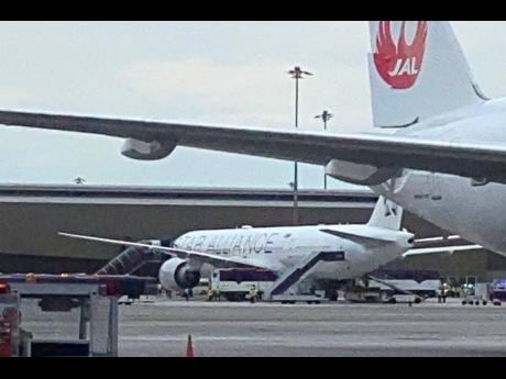 The Boeing 777-300ER aircraft of Singapore Airlines, flight SQ321 from Heathrow is seen on the tarmac after requesting an emergency landing at Bangkok's Suvarnabhumi International airport, Thailand, Tuesday, May 21, 2024.