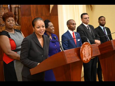 Marlene Malahoo Forte, (second left)  speaks as (from left) members of the Constitutional Reform Committee, Nadeen Spence, Elaine McCarthy, Rocky Meade, Derrick McKoy and Sujae Boswell look on