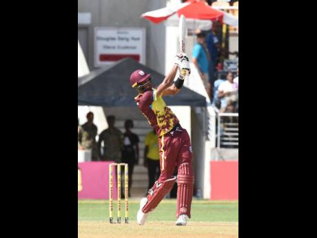 West Indies all-rounder Roster Chase swings to leg during his man-of-the-match innings of 67 not out against South Africa in the second T20 International between the teams at Sabina Park yesterday. West Indies lead the three-match series 2-0.