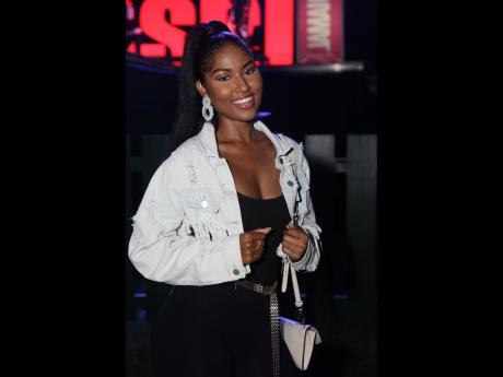  Miss Jamaica World 2022 Shanique Singh kept it simple and cute, pairing a black jumpsuit with a cropped denim jacket and matching accessories.