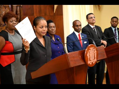 Marlene Malahoo Forte, (second left) speaks while (from left) members of the Constitutional Reform Committee, Nadeen Spence, Elaine McCarthy, Rocky Meade, Derrick McKoy, Sujae Boswell, look on at post cabinet press briefing at Jamaica House on Wednesday, M