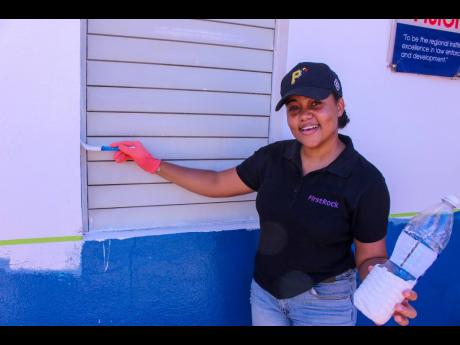 First Rock Group Receptionist, Alexandra McNamee, paused the Labour Day activities at the National Police College of Jamaica to share a smile with the camera on Thursday.