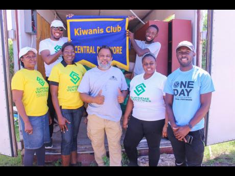Members of the Kiwanis Club of Central Portmore joined Supreme Ventures Limited at the New Horizon Center of Excellence in Spanish Town, St Catherine, for Labour Day activities on Thursday. (Front, left to right): McKayla Financial Services Accountant Dawn
