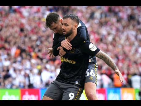 Southampton’s Adam Armstrong (front) celebrates scoring during the Championship play-off final against Leeds United at Wembley Stadium, London, yesterday.