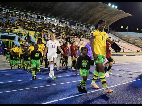 Jamaica’s Reggae Girlz walking out on to the National Stadium pitch ahead of an international.