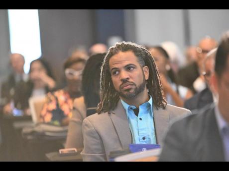 Shipping Association of Jamaica managing committee member Neil Smith is all ears during the opening session of the Caribbean Shipping Executives’ Conference on Monday, May 20.