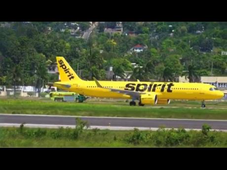 Spirit Airlines Flight NK270 on its return to the Sangster International Airport with emergency services standing by. 

