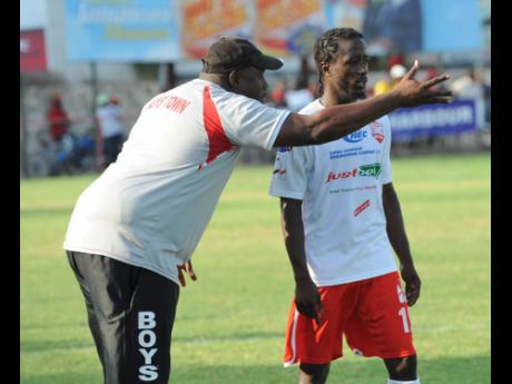 Andrew Price, then Boys’ Town coach, issues instructions to Rafiek Thomas during a Jamaica Premier League match at Boys’ Town. Price said he was devastated by the player’s passing.