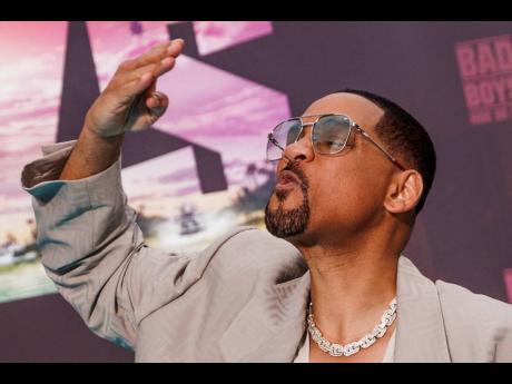 
Actor Will Smith greets fans as he arrives for the European premiere of the film ‘Bad Boys: Ride or Die’ at the Zoo Palast in Berlin. 