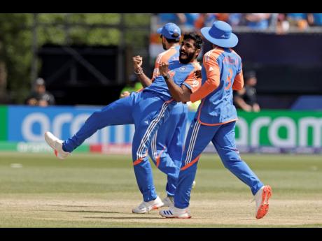 India’s Jasprit Bumrah (centre) celebrates the dismissal of Pakistan’s Mohammad Rizwan during the ICC Men’s T20 World Cup match against Pakistan at the Nassau County International Cricket Stadium in Westbury, New York, yesterday.