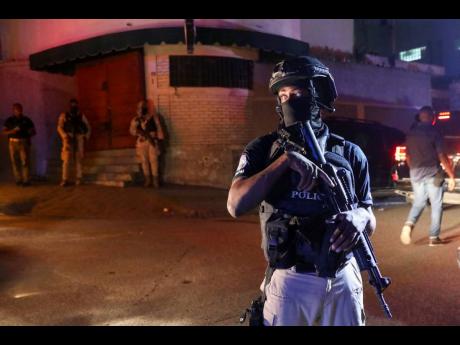 Police guard outside the hospital where Haiti’s newly selected prime minister, Garry Conille was hospitalised in Port-au-Prince, Haiti late Saturday.