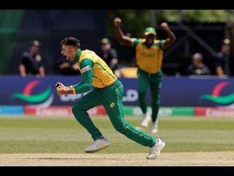 South Africa’s Keshav Maharaj celebrates the dismissal of Bangladesh’s Mahmudullah Riyad during an ICC Men’s T20 World Cup cricket match against Bangladesh at the Nassau County International Cricket Stadium in Westbury, New York yesterday.