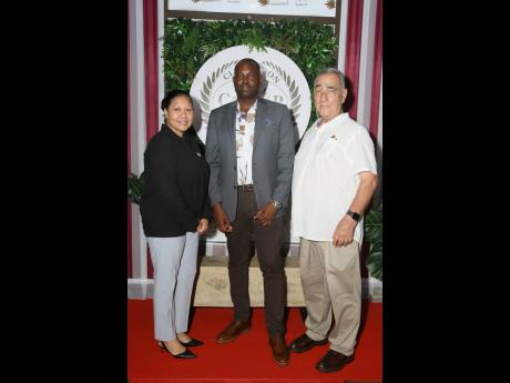  SSP Carlos Russell is flanked by Custos of Clarendon Edith Chin (left), and William Shagoury, former Custos of the parish.