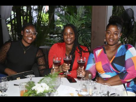 Constables (from left) Tanielle Fillington, Santena Grandison, and Kemoy Boothe-Forbes toast to a memorable occasion.