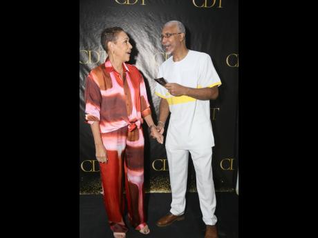 Eva Lewis, chair of the CDT and chief executive officer of Citibank Jamaica, greets Tony Henry, a former lead dancer with the original Company Dance Theatre.