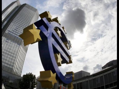 
The euro sign is displayed at the European Central Bank in 2012. ECB incorporated climate change considerations into its mandate in 2021.