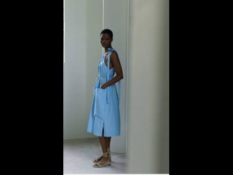 The African SAINT, a Lagos university English literature graduate, is leisurely fab in this blue, striped cotton pocket dress.