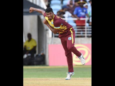 Player of the Series, Gudakesh Motie, bowls during the final game of that series against South Africa at Sabina Park on May 26.
