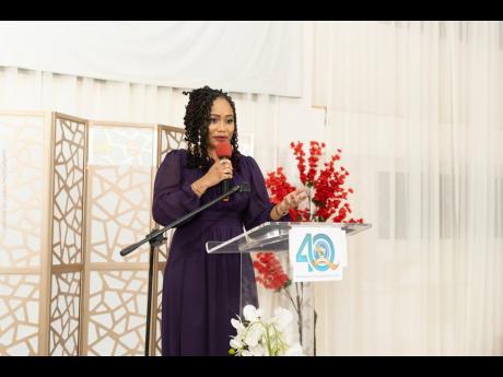 Danielle Archer, attorney-at-law, principal director at National Integrity Action and past student, delivering the keynote address at the El Instituto de Mandevilla 40th Anniversary Homecoming and Awards Banquet.