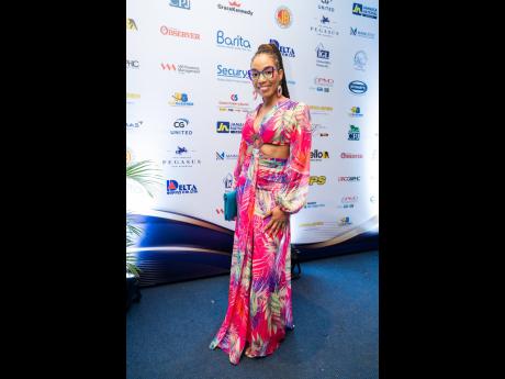 Imega Breese McNab, corporate affairs manager at Carreras Limited, turned heads in a tropical print dress.