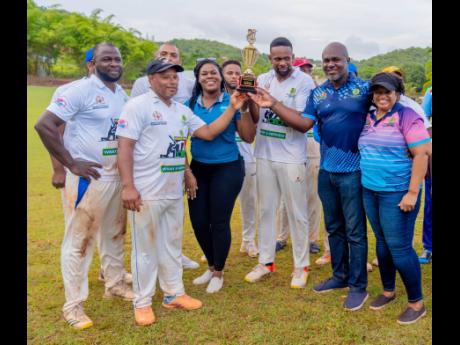 Ronique Rhoden (third from left) Director of Community Engagement, HEART NSTA Trust, Alric Miller (second right), Parish Manager, St Elizabeth SDC  and  Jennifer Simpson (right)  Community Development Officer, SDC join in presenting the first place trophy 