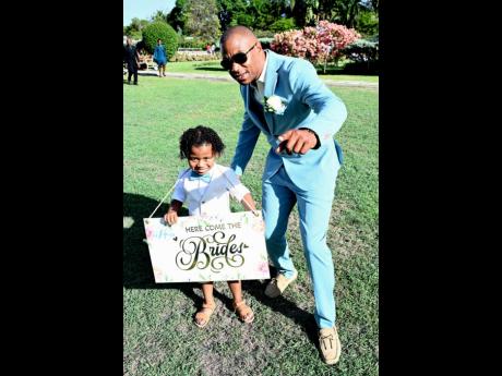 Rainel Woerdings (right) and his 4-year-old son Zenso were anxiously awaiting the entrance of the bride. 
