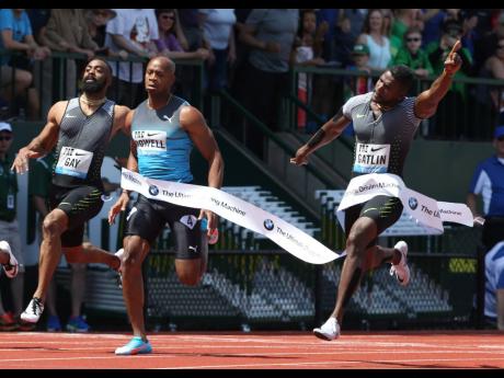 
Justin Gatlin (right) wins the men’s 100 metres ahead of (from left) Tyson Gay and Asafa Powell, at the Prefontaine Classic track and field meet in Eugene, Oregon in 2016. 