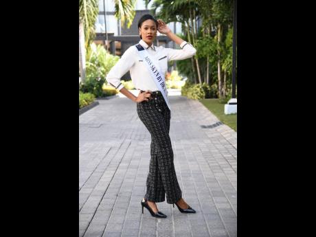 Shanique Rogers pairs a stylish chignon with tweed dress pants.