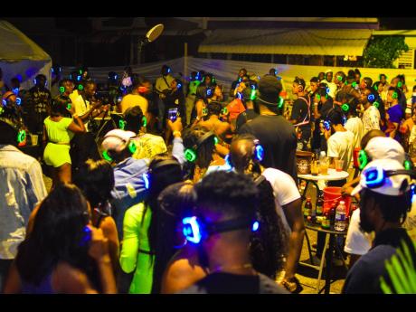Partygoers enjoying Askel 45 headphone party in Portsmouth, Portmore, last December.