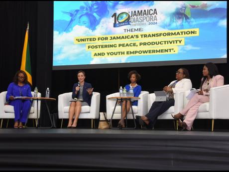 Senator Kamina Johnson Smith (second left), minister of foreign affairs and foreign trade, addresses the delegates on Day One of the 10th Biennial Jamaica Diaspora Conference at the Montego Bay Convention Centre in Rose Hall, Montego Bay, yesterday. Other 