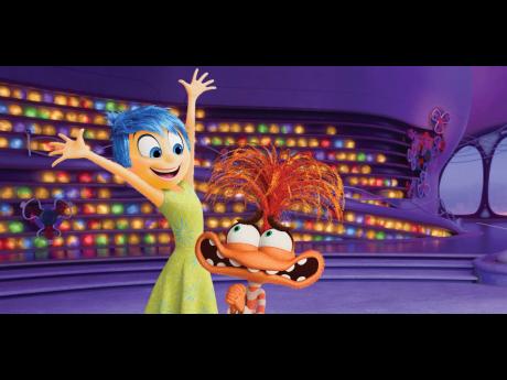 This image released by Disney/Pixar shows Joy, voiced by Amy Poehler (left), and Anxiety, voiced by Maya Hawke, in a scene from ‘Inside Out 2’.