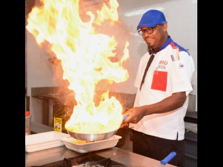 Oneil Vernon, executive chef at RIU Palace Aquarelle in Falmouth, Trelawny, preparing ackee and salt fish.
