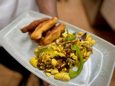 Ackee and salt fish, served with fried festivals.