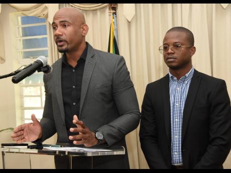 Dr Alfred Dawes (left), opposition spokeman on health, and his deputy, Jessie James, address the media during a press conference at the Office of the Leader of the Opposition in St Andrew yesterday.