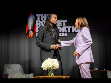 Vice President Kamala Harris (right) greets hip-hop star Quavo at his summit to stop gun violence at the Carter Center in Atlanta on Tuesday.