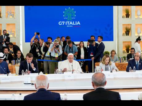 Pope Francis (centre) addresses world leaders during a working session on AI, Energy, Africa and Mideast at the G7 summit, in Borgo Egnazia, near Bari in southern Italy, on June 14.