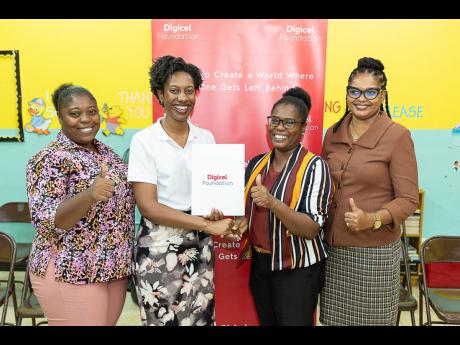 Saluting the recent singing of a memorandum of understanding between the Digicel Foundation and the Ministry of Education and Youth to establish a smart room at the Mountain View Primary & Infant School are (from left) Shantal Lee Fisher, school PTA presid