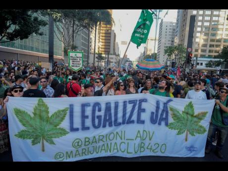 AP 
Demonstrators hold a banner that reads in Portuguese, “Legalise now”, during a march demanding the legalisation of marijuana in Sao Paulo, Brazil, on June 16, 2024.
