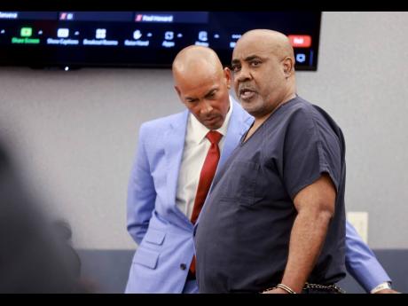 Duane ‘Keffe D’ Davis (right), who is accused of orchestrating the 1996 slaying of hip-hop icon Tupac Shakur, talks to his attorney, Carl Arnold, in court at the Regional Justice Center in Las Vegas on Tuesday.
