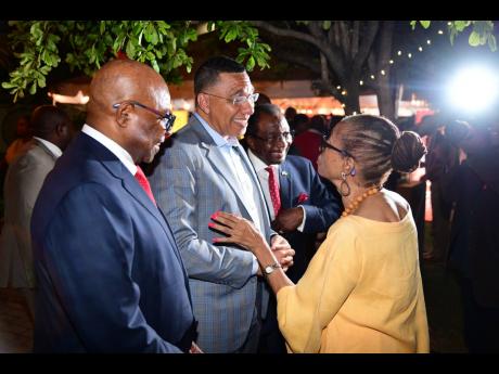 Seemingly imparting some sage wisdom, Beverley Manley-Duncan (right) chats with (from left) Tourism Minister Edmund Bartlett, Prime Minister Andrew Holness, and US Ambassador to Jamaica N. Nick Perry.
